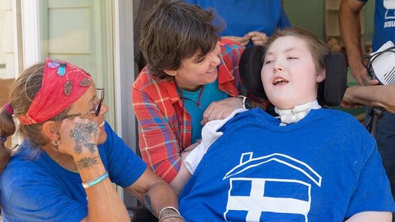 Noah, his mom and a volunteer