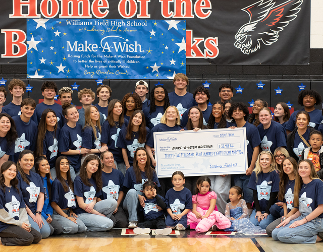 Group picture of students at Williams Field High School in Arizona presenting a check of fundraised money to Make-A-Wish