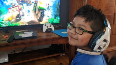 Wish Kid Daniel playing Xbox