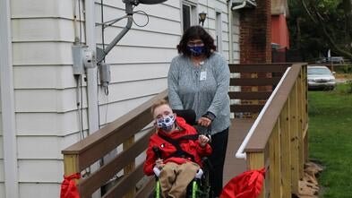Collin on his new wheelchair ramp
