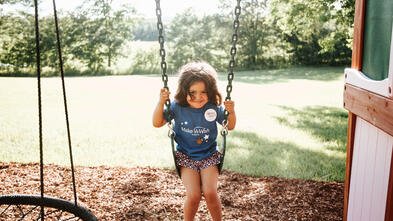 Johanna swinging in her swing 
