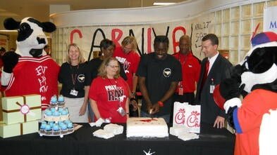 Wish kid Rashawn with the meal service team