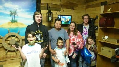 Wish kid Levi and his family enjoying their escape room surprise