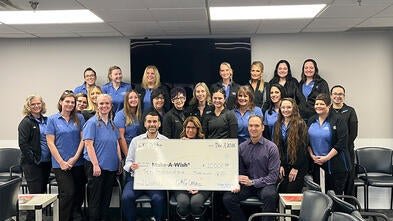 The staff of GKG Orthodontics presents its donation to wishes.