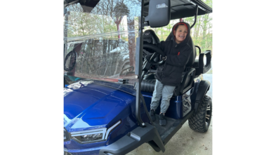 wish kid in golf cart