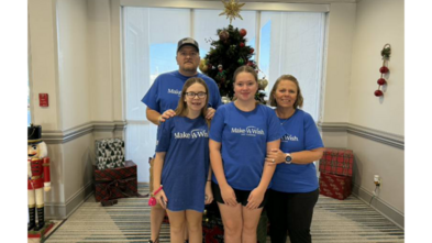 Wish family in front of Christmas tree