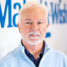 Rob LaMaster, Regional Director, Southern Arizona, in front of Wish Wall