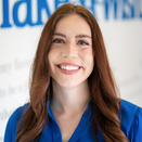 Nicole Kendle, Senior Digital Marketing Manager, smiling in front of Wish Ball